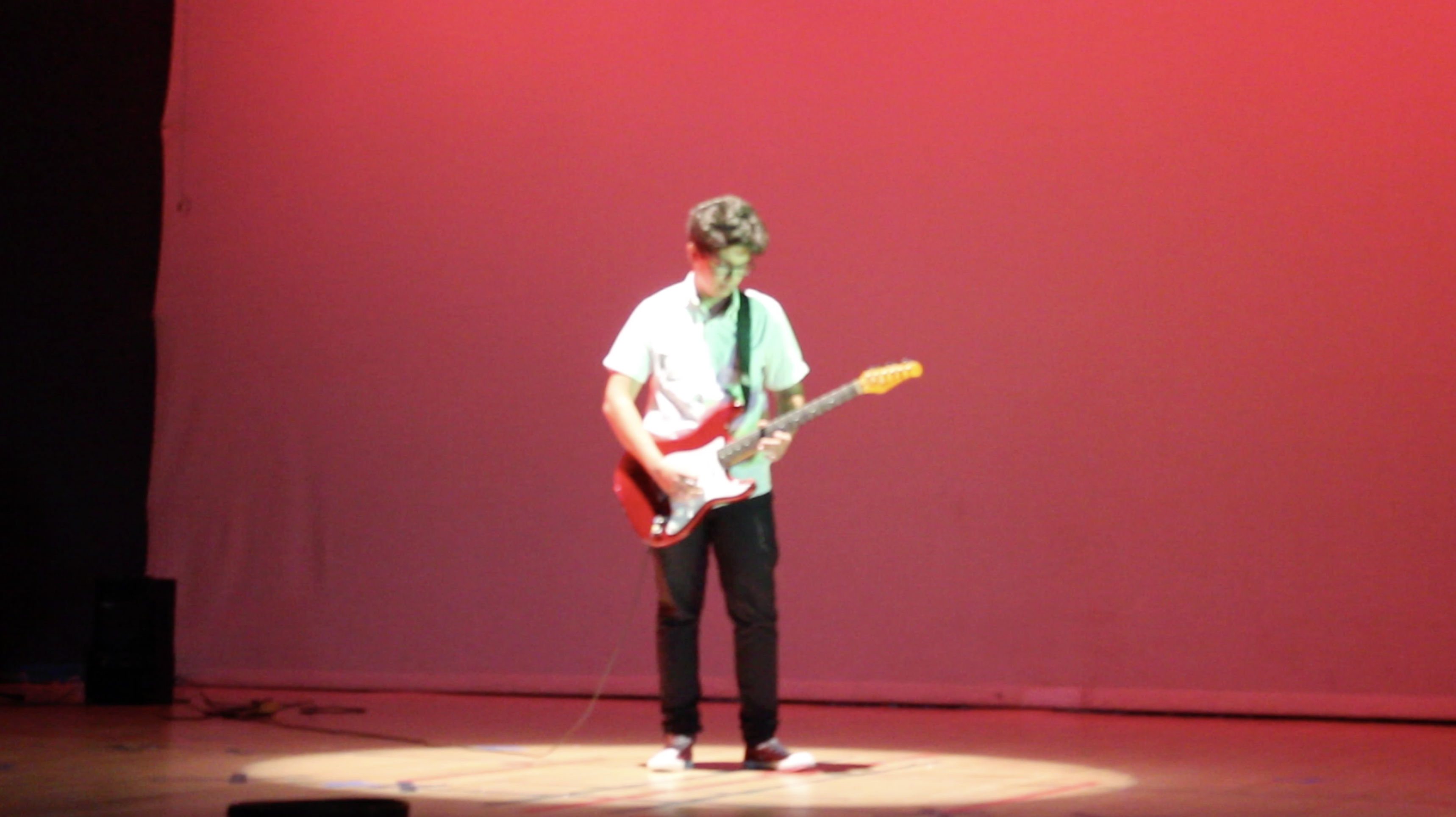 Nizar Masadeh guitar performance at Jubilee School graduation ceremony